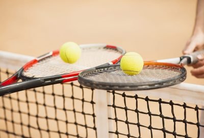 tennis-couple-holding-tennis-rackets